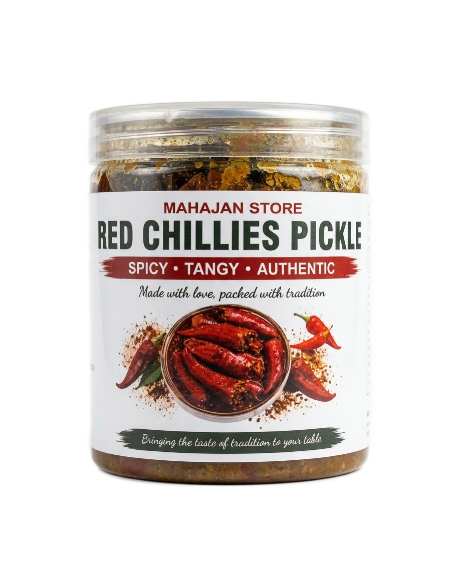 Whole stuffed red chilli pickle soaked in mustard oil inside a glass jar.